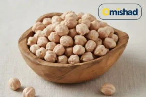 نخود کرمانشاه دوخان عمده 5 کیلویی 2 نخود کرمانشاه دوخان عمده 5 کیلویی در کاسه چوبی با دانههای درشت و روشن روی زمینه روشن.