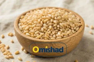 تجارتخانه گندم 9 گندم پوستکنده حلیمی با دانههای روشن و یکنواخت داخل کاسه چوبی.